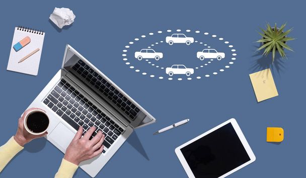 Top view of hands using laptop with symbol of connected cars concept - Fotó, kép