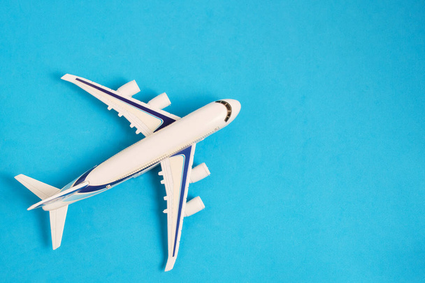 Airplane model blue background.Concept travel and recreation - Fotoğraf, Görsel