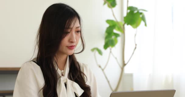 Tokyo Japan 06.19.2022. This working scene is acted by Japanese model in the office. High quality 4k footage - Materiał filmowy, wideo