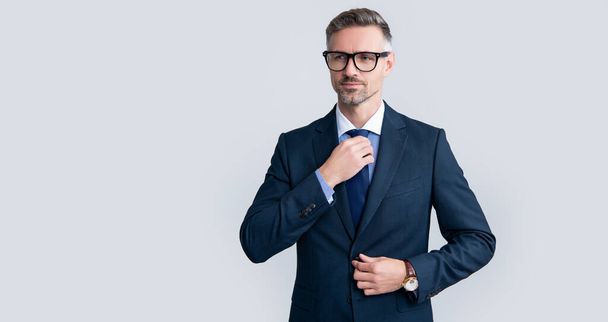 positive mature businessman in businesslike suit and glasses. - Fotó, kép