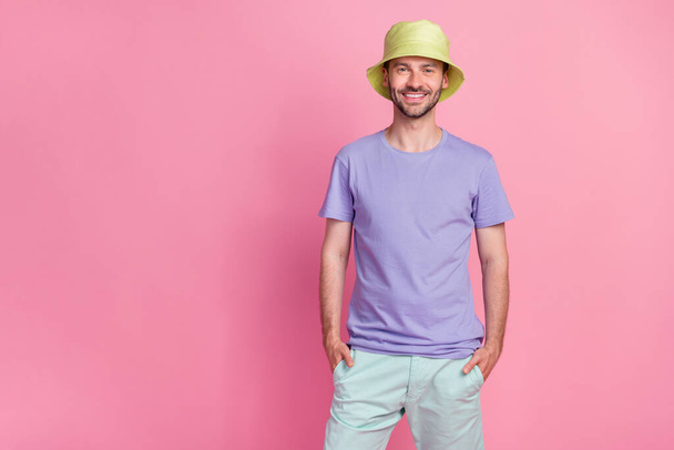 Photo of cool good mood gentleman boy wear violet outfit trendy head accessory stand empty space isolated on pink color background. - Фото, зображення