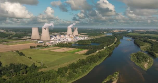 Aerial panoramic flight of around the nuclear power plant. Carbon dioxide emissions, energy of smoke and steam. Ecology and pollution of nature. High quality 4k footage - Imágenes, Vídeo