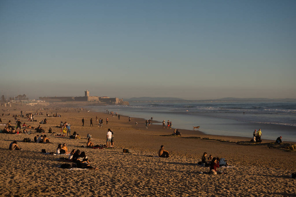 Carcavelos, Lisbon, Portugal, 2020 - People relaxing at the Carcavelos beach - Photo, Image