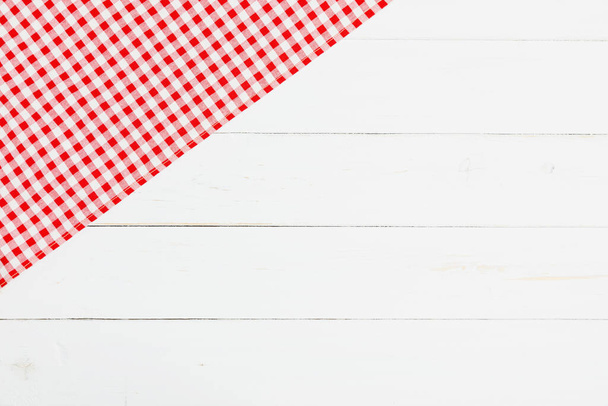 Clothes red and white on white background for a menu of a restaurant with copy space. Top view fabric tablecloth on old white wood background. Flat lay checked fabric old wooden. - Fotoğraf, Görsel