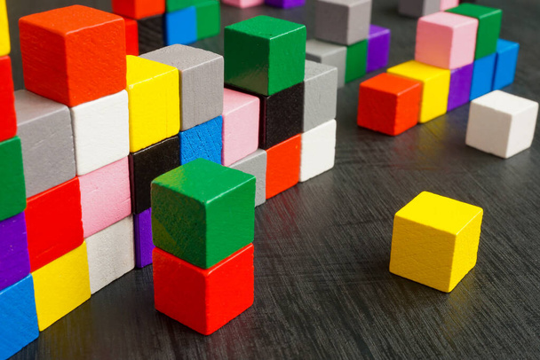 Multicolored cubes on the surface as a symbol of complexity, diversity and integration. - Fotoğraf, Görsel
