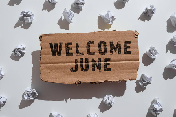 Sign displaying Welcome June, Business idea Calendar Sixth Month Second Quarter Thirty days Greetings Paper Wraps Placed Under Cardboard With Important Information. - Zdjęcie, obraz