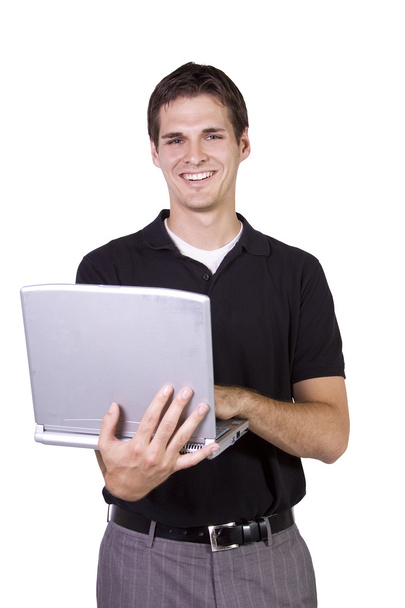 Young man standing and working on laptop - Foto, Imagem