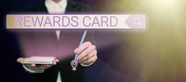 Writing displaying text Rewards Card, Word Written on Help earn cash points miles from everyday purchase Incentives Lady in suit holding pen symbolizing successful teamwork accomplishments. - Foto, Imagem