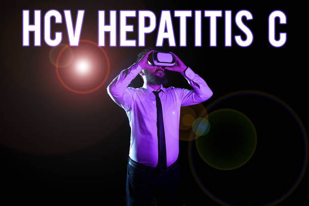 Text caption presenting Hcv Hepatitis C, Word Written on Liver disease caused by a virus severe chronic illness Businessman Taking Professional Training Through Virtual Reality Goggles. - Foto, Bild