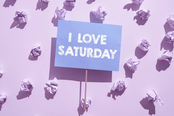 Text showing inspiration I Love Saturday, Business idea To have affection for the weekend happy excited relax Wrinkled Notes Under Piece Of Paper With Important Message Glued On Stick. - Photo, image