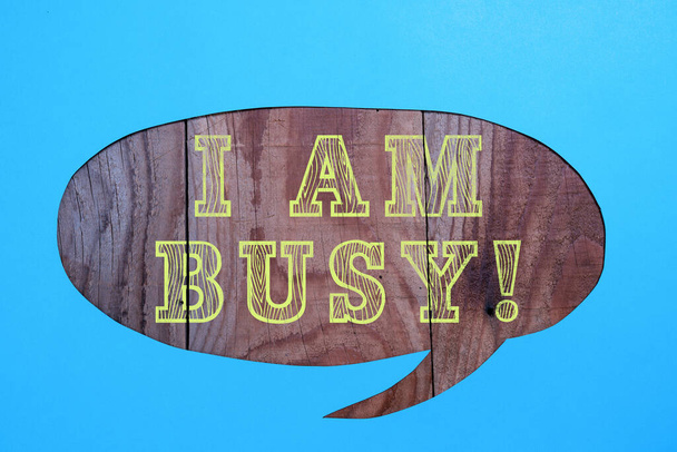 Text sign showing I Am Busy, Word Written on To have a lot of work to do Stressed out no time for leisure Cropped Speech Bubble With Important Message Placed On Floor. - Foto, Bild