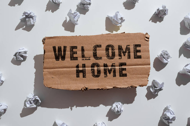 Sign displaying Welcome Home, Conceptual photo Expression Greetings New Owners Domicile Doormat Entry Paper Wraps Placed Under Cardboard With Important Information. - Fotoğraf, Görsel