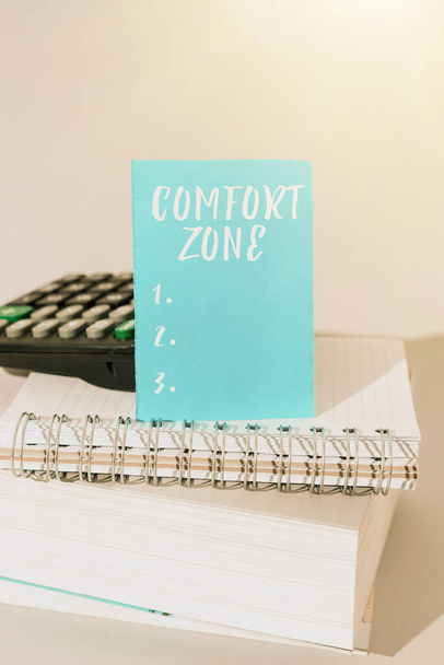 Writing displaying text Comfort Zone, Word Written on A situation where one feels safe or at ease have Control Important Message Presented On Piece Of Paper On Desk With Keyboard. - Photo, Image