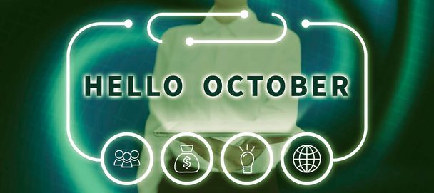 Text showing inspiration Hello October, Internet Concept Last Quarter Tenth Month 30days Season Greeting Businesswoman Holding A Tablet With Digital Display Of S And Data. - Foto, imagen