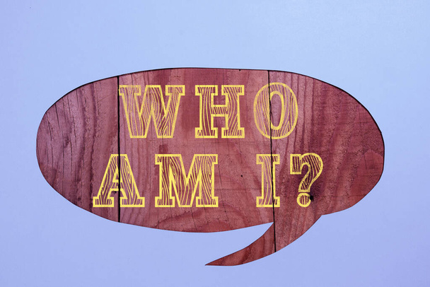 Hand writing sign Who Am I, Word Written on Introduce Identify yourself personality likes dislikes profile Cropped Speech Bubble With Important Message Placed On Floor. - Photo, image