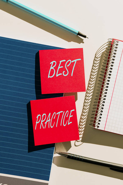 Handwriting text Best Practice, Internet Concept Method Systematic Touchstone Guidelines Framework Ethic Important News Presented On Two Sticky Notes On Desk With Notebook And Pens - 写真・画像