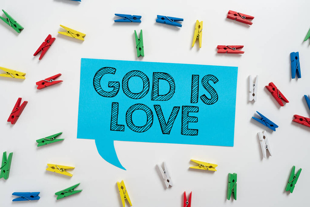 Text caption presenting God Is Love, Conceptual photo Believing in Jesus having faith religious thoughts Christianity Colorful Pegs Placed Around Speech Bubble With Important Information. - Fotó, kép