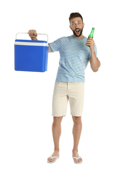 Emotional man with cool box and bottle of beer on white background - Foto, Imagem