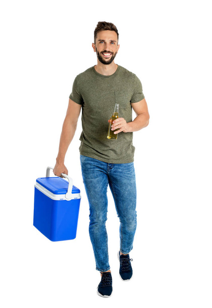 Happy man with cool box and bottle of beer on white background - Foto, imagen
