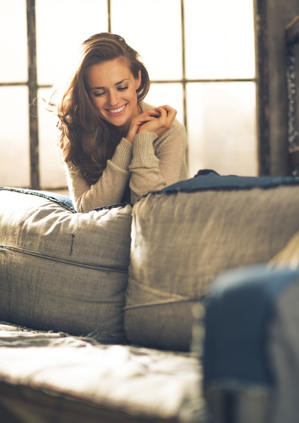 Portrait of happy young woman in loft apartment - Φωτογραφία, εικόνα
