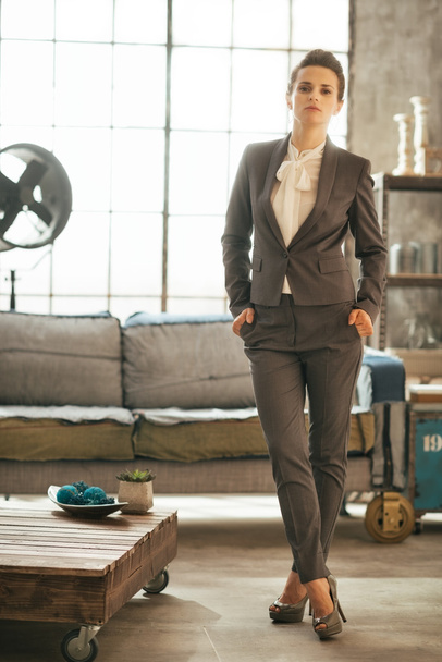 Full length portrait of business woman in loft apartment - Фото, зображення