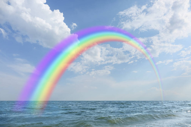View of sea and beautiful rainbow in sky   - Photo, Image