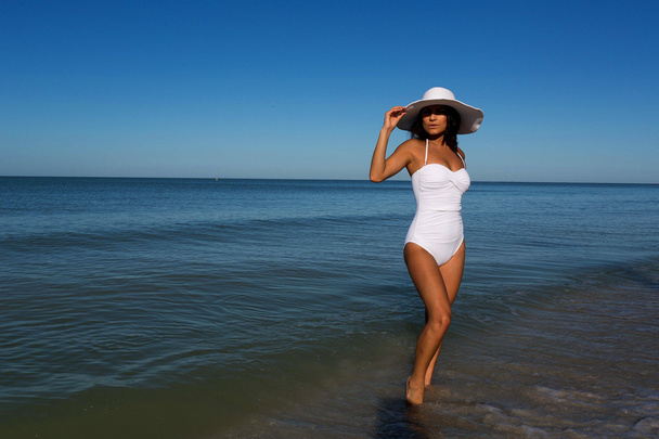 Young woman on beach - Фото, изображение