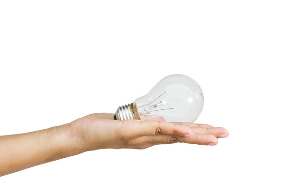 Light bulb in woman hand on white background - Foto, afbeelding