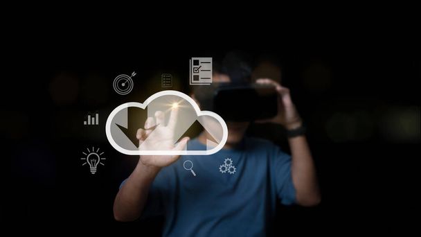 man wearing VR glasses and accessing the cloud server computing connection data information large database big data. Cloud computing and technology internet of things storage network concept. - Fotoğraf, Görsel