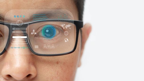 man wearing eyeglasses with virtual screen future technology, biometric of a scientist with futuristic graphics and holography with which scans, immersive technology, metaverse universe. - Foto, immagini
