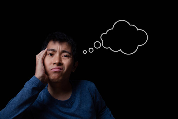 Thinking man with cloud thought sketched above his head, thinking bubble icon. Man thinking about a problem concept. black background. - 写真・画像