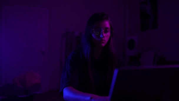 Attractive young woman working in home at night. Girl using laptop. - Imágenes, Vídeo