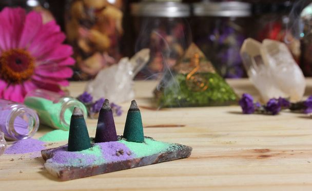 Incense Cones on Stone Slab With Chakra Crystals and Flowers - Fotografie, Obrázek