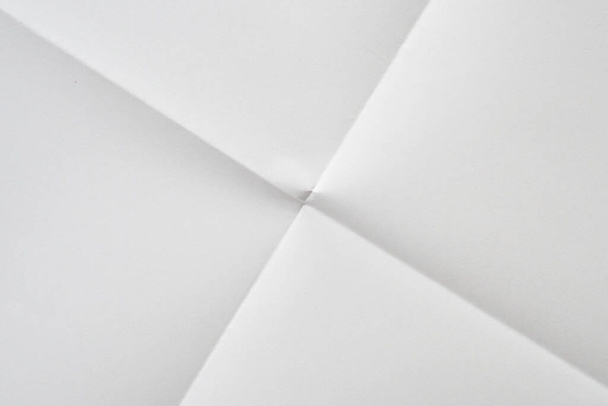 White folded and wrinkled paper texture background - Foto, imagen
