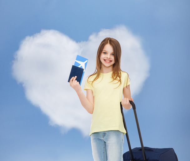smiling girl with travel bag ticket and passport - Valokuva, kuva