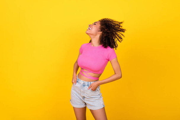 Photo of adorable positive person put hands pockets laugh enjoy freedom isolated on yellow color background. - Fotó, kép