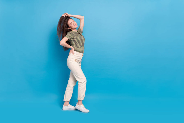 Full size photo of nice millennial lady look promo wear casual cloth isolated on blue background. - Фото, зображення
