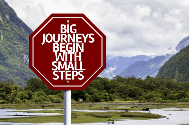 Big Journeys Begin With Small Steps written on red road sign - Photo, Image