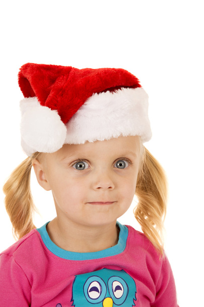 Wide eyed blond girl portriat wearing santa hat - Foto, afbeelding