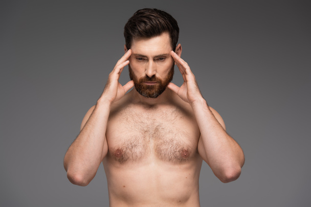 shirtless and thoughtful man with beard touching temples isolated on grey - Fotoğraf, Görsel