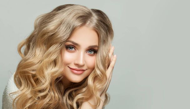Blonde beauty. Lovely young woman smiling - Фото, зображення