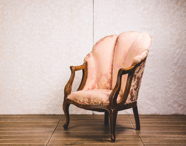 View of an old classical vintage armchair. Old retro style concept. - 写真・画像