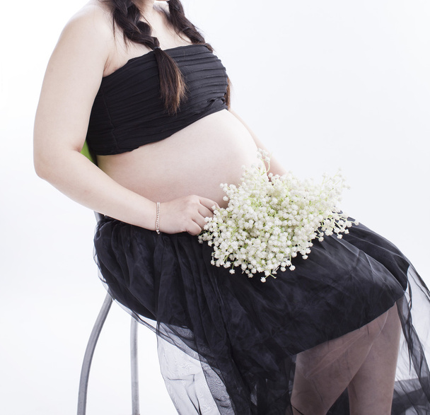 A pregnant mother in white background - Foto, imagen