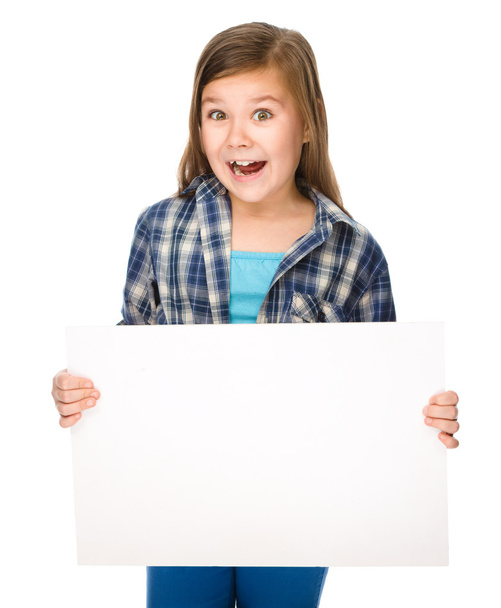Little girl is holding a blank banner - Fotoğraf, Görsel