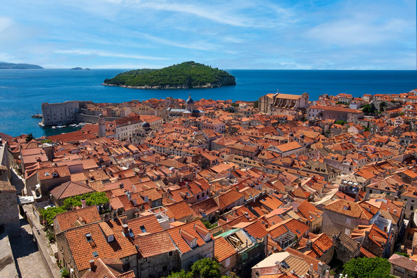 Lokrum Island stands out when looking south from the elevated  Old Town Wall of Dubrovnik, Croatia - Fotoğraf, Görsel