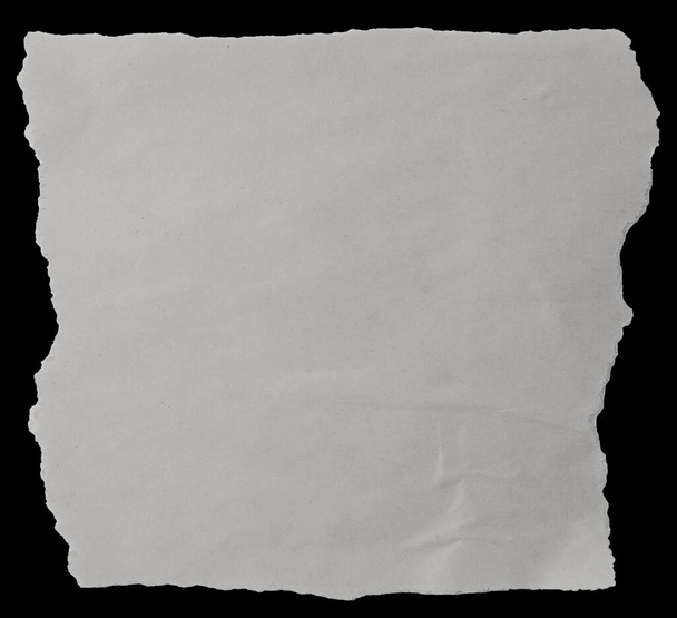 Piece of torn paper on black - Zdjęcie, obraz