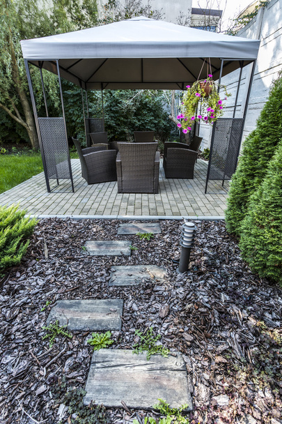 Beauty garden with wicker furniture - Foto, Imagen
