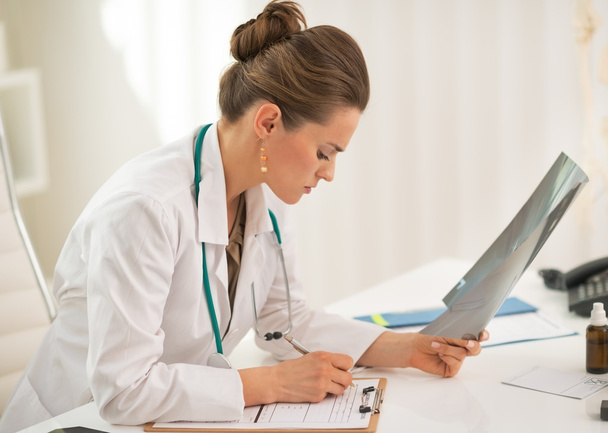 Doctor woman with fluorography working in office - Zdjęcie, obraz