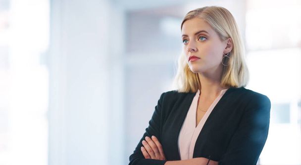 Think for ward is the key. a confident young businesswoman standing with her arms folded inside of the office - Фото, зображення