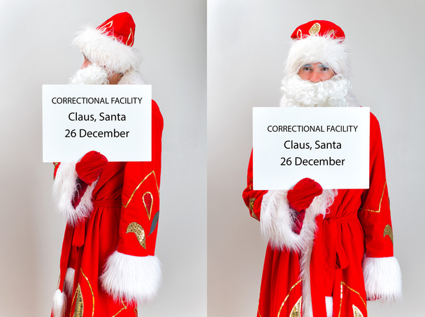Санта Клаус Магшот. Санта держит доску с именами
. - Фото, изображение
